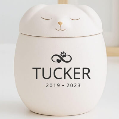 Personalisierte Hundeurne mit Tierfigur-Deckel...